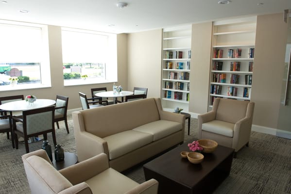 Cozy common area with bookshelves and seating