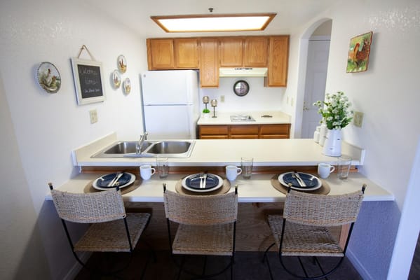 Bright interior kitchen area with dining setting