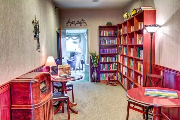 Cozy library area with bookshelves and tables
