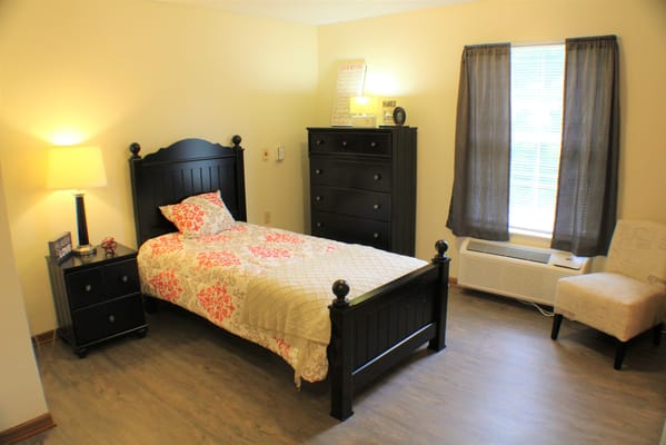 Private resident room with a bed and furniture