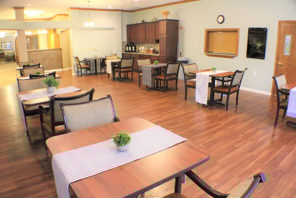 Bright dining area with tables and chairs