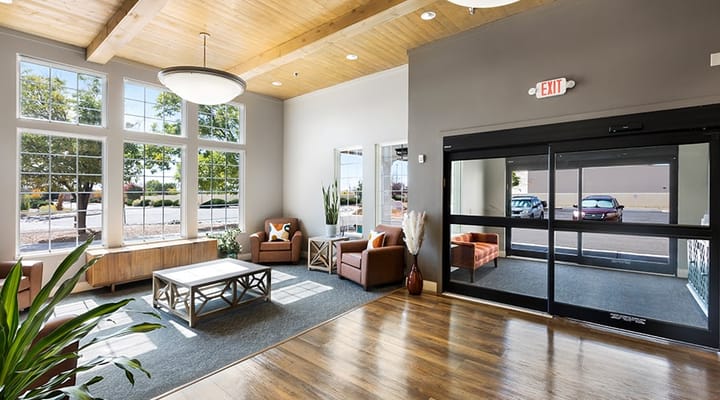 Spacious lobby with seating and large windows at Kingston Residences