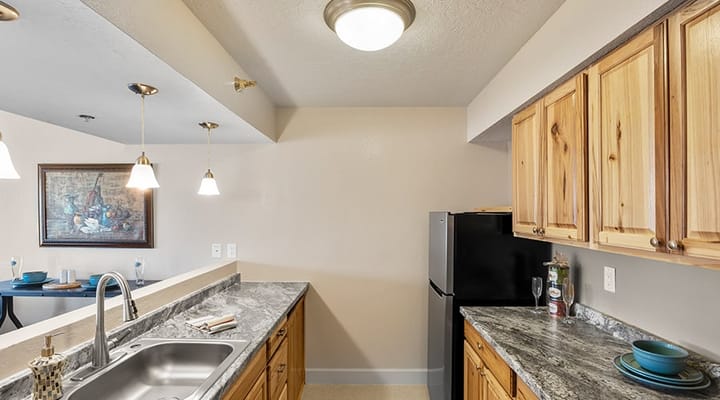 Bright kitchen with wooden cabinets and modern appliances