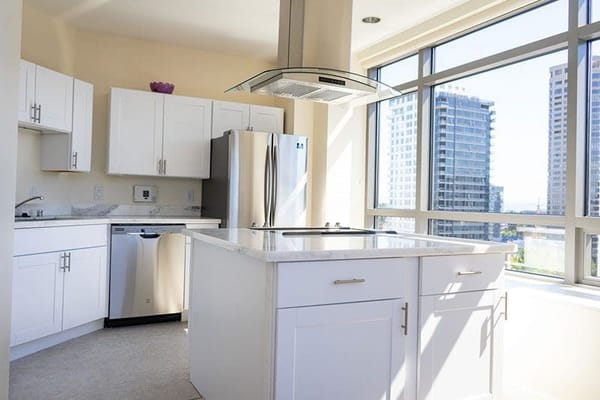 Bright kitchen with modern appliances and large windows