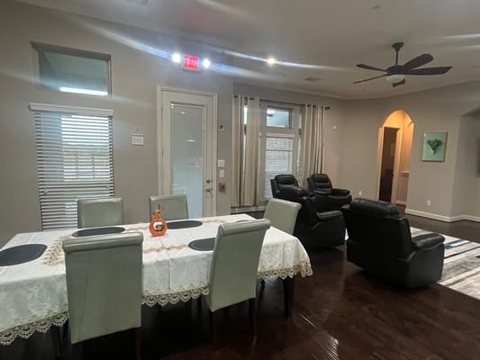 Interior view of a lounge area with seating and dining table