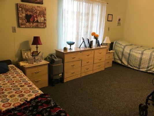 Cozy resident room with two beds and personal touches