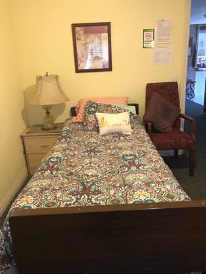 Cozy bedroom setup with colorful bedding and decor