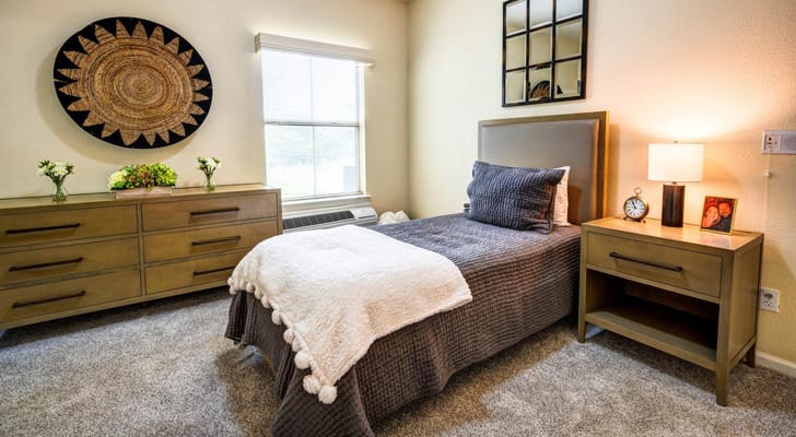 Cozy resident room with a bed and decor