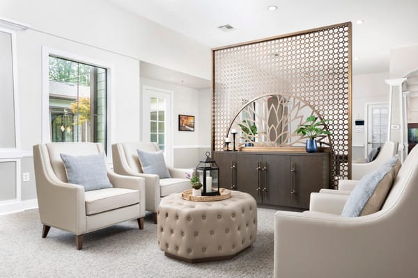 Bright common area with modern seating and decor