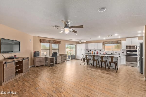 Spacious kitchen and dining area with modern appliances and seating