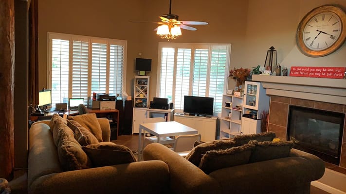 Spacious living room with sofas, coffee table, and entertainment area