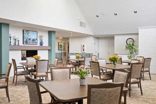 Comfortable seating area with tables and floral arrangements