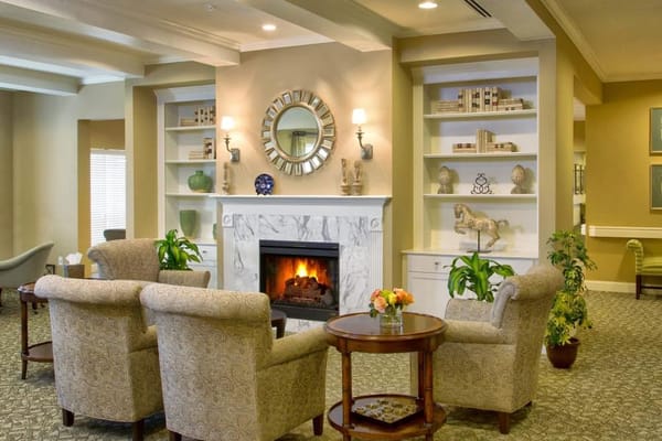 Bright and inviting common area with fireplace