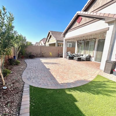 Outdoor patio area with seating and landscaping