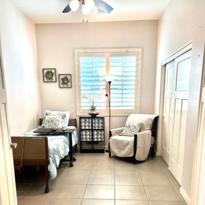 Cozy resident room with a bed and chair