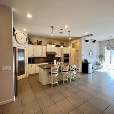 Bright common area with a kitchen and seating