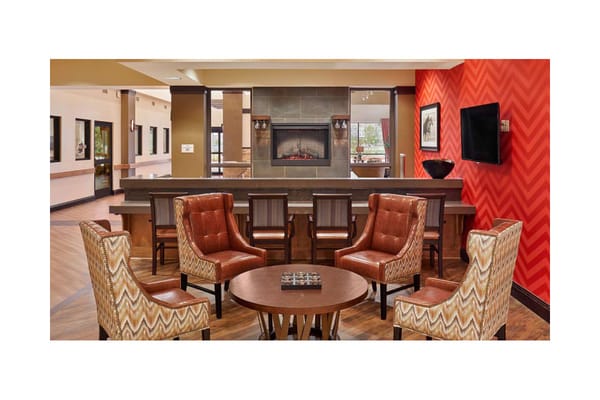 Common area with armchairs and a fireplace