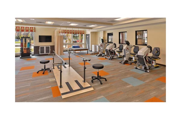 Rehabilitation gym with equipment and therapy area