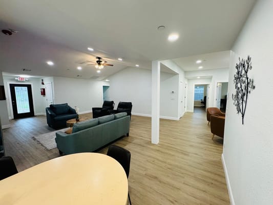 Bright common area with seating and natural light