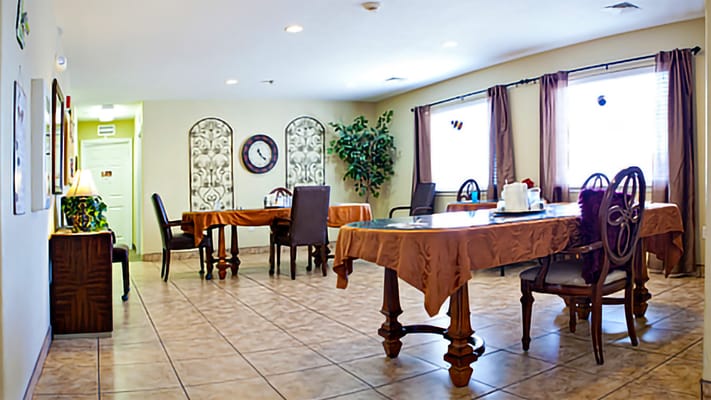 Dining area with tables and chairs set up