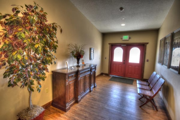 Interior hallway with seating and decorative plants