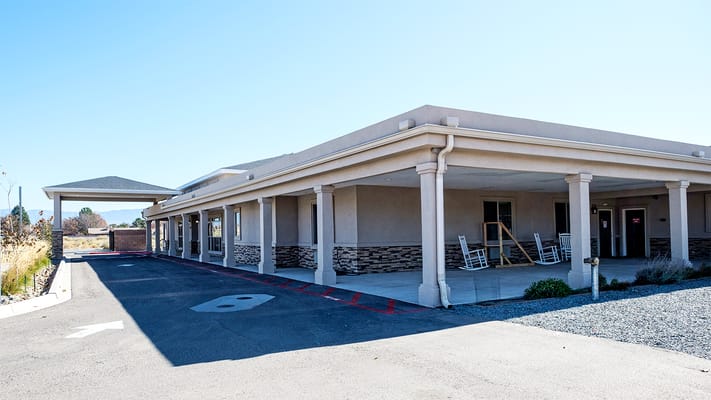 Exterior view of a senior living facility with a porch