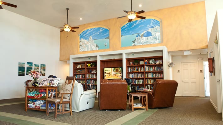 Common area with seating and bookshelves