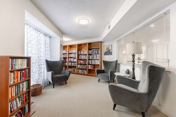 Cozy common area with bookshelves and seating