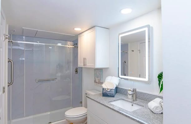 Bright, modern bathroom with shower and vanity.