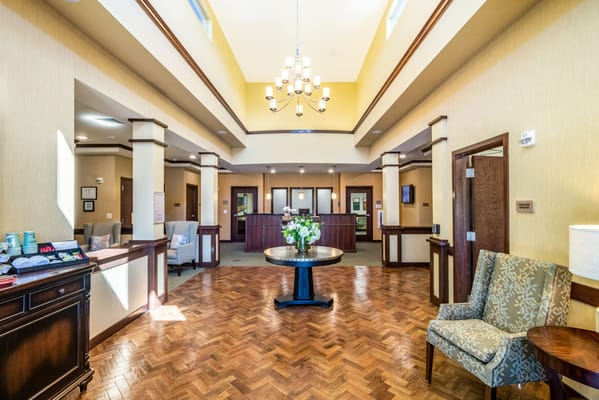 A spacious lobby with seating and reception area at Porter Place.