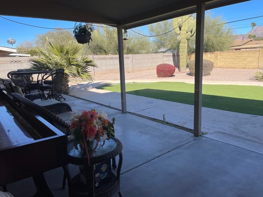 View from the patio of Rainbow House with greenery and cacti.