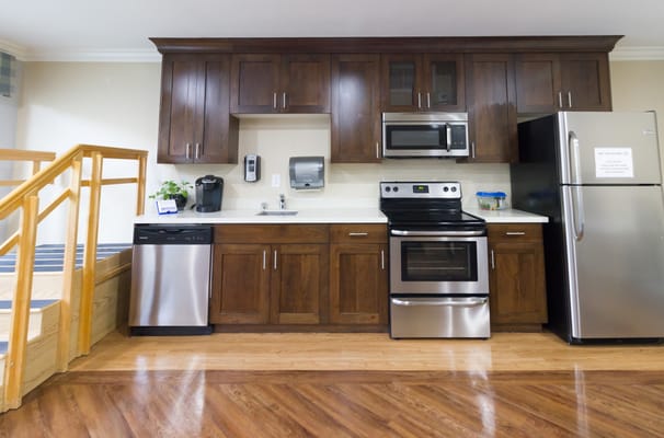 Interior view of a kitchen with appliances and cabinets
