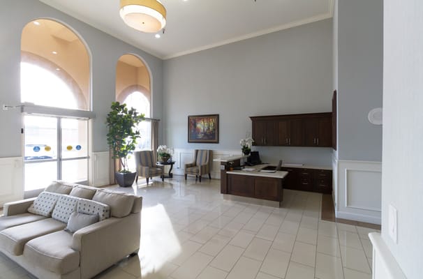 Spacious lobby area with seating and artwork