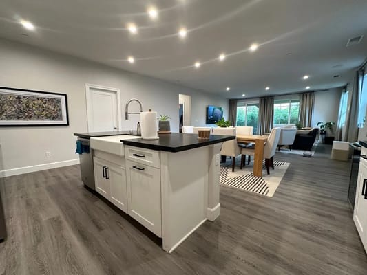 Bright kitchen with dining area in senior living facility.