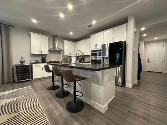 Contemporary kitchen with seating at a bar.