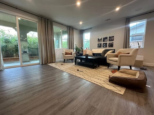 Spacious living room with modern furniture and large windows