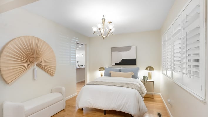 Cozy private room with bed and decorative elements