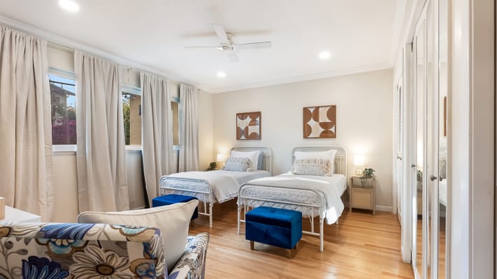 Bright interior of a resident's room with twin beds