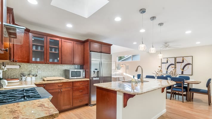 Bright kitchen area with dining space in a senior living facility