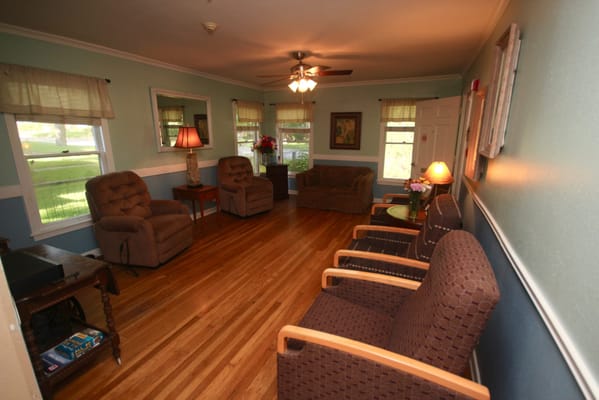 A cozy living room with comfortable seating and natural light.