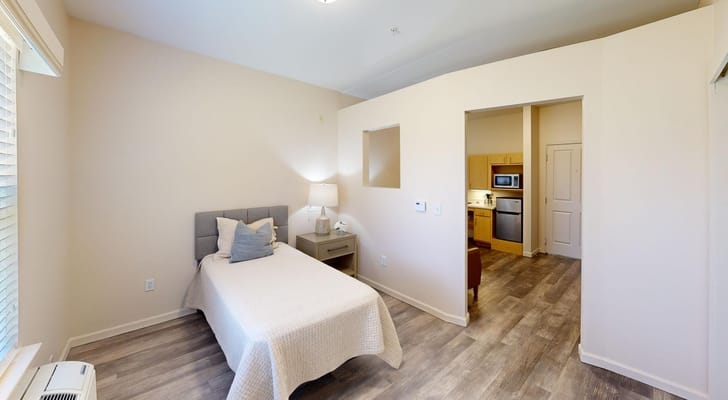 Light-filled private resident room with kitchenette