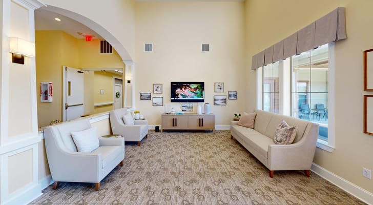 Bright common area with seating and television