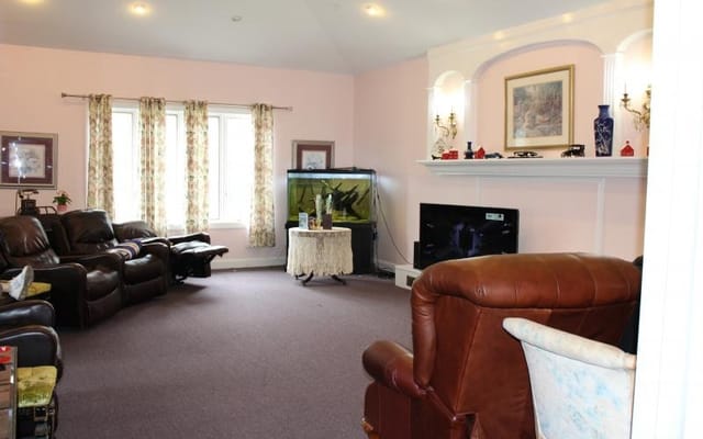 Cozy living room with leather chairs and an aquarium