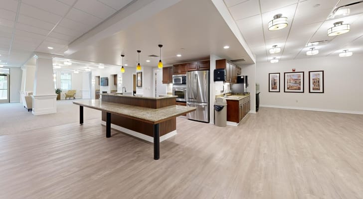 Spacious common area with kitchen and seating at The Auberge at Brookfield