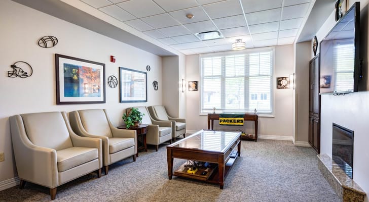 Comfortable seating area with sports-themed decor