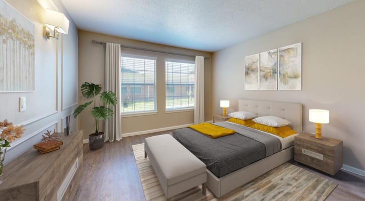 Bright and inviting bedroom with a bed, nightstand, and windows