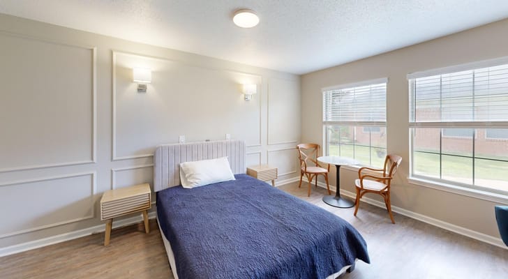 Bright and inviting bedroom with a bed and seating area