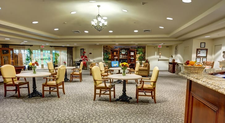 Comfortable lounge area with tables and chairs in The Auberge at The Woodlands