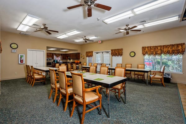 Spacious multipurpose room with tables and chairs
