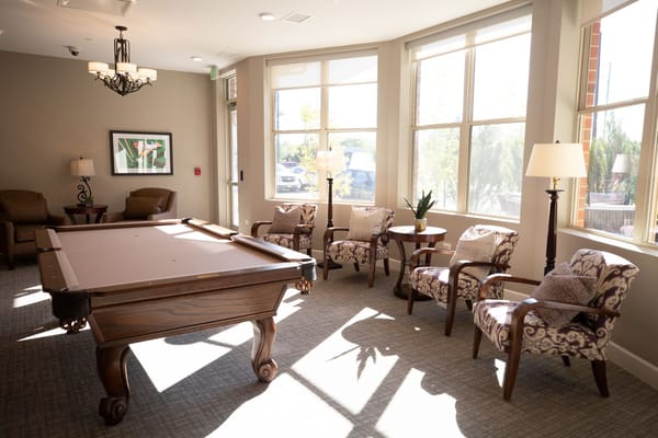 Cozy lounge area with a pool table and seating